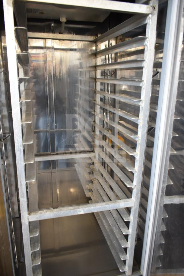Coldline C-1FE Single Door Reach-In Freezer with pan rack, commercial casters, 115V, good condition.