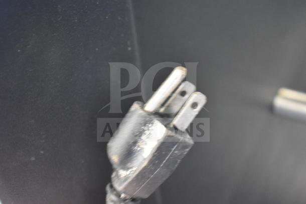 Vulcan 1013776 Commercial Pastry Merchandiser on casters; shown power plug, metal prongs, moderate wear.