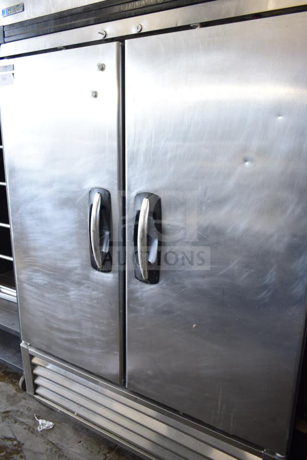 Master Bilt R49-S 2-door reach-in cooler, stainless steel, on casters. Visible dents; commercial use, 115 volts, 1 phase.