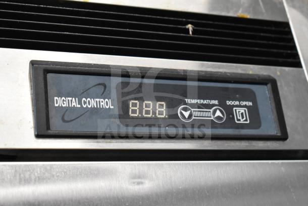 Kool It KBSF-2 digital control panel on commercial 2 door reach-in freezer. Features temperature and door indicators.