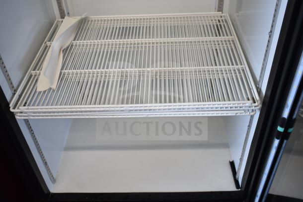 Imbera G319 commercial single door reach-in cooler merchandiser interior, featuring wire shelves, 115 volts, 1 phase.