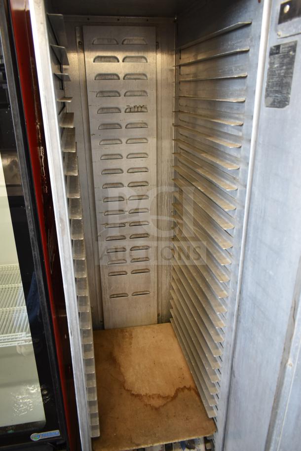 Lockwood Commercial Heated Holding Pan Rack on casters, metal construction, adjustable racks, used condition, interior detail.