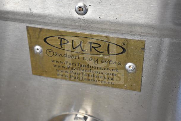Puri Tandoori Clay Oven, commercial grade on casters. Brass label reads "Puri Tandoori clay ovens" with website URLs.