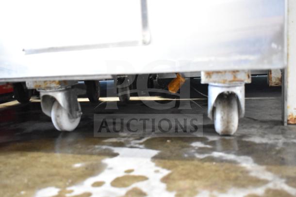 Puri Commercial Tandoori Clay Oven on casters, showing durable wheels for mobility in a professional kitchen.