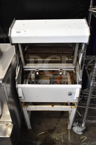Oliver 777 Commercial Bread Loaf Slicer, floor style, model 777, showing wear, 115 volts, 1 phase, auction tag 165 visible.