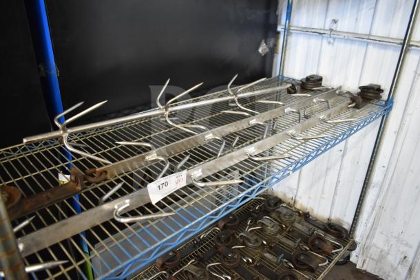 Metal trolley rollers with hook meat hangers on a wire shelf. Good condition, auction lot tag labeled "170 V3".