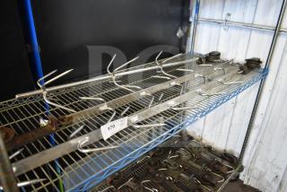 Metal trolley rollers with hook meat hangers on a wire shelf. Good condition, auction lot tag labeled "170 V3".