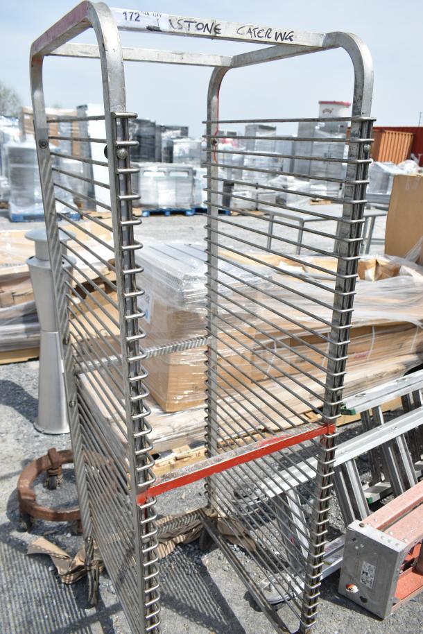 Commercial pan transport rack with durable metal frame, on commercial casters. Label reads "STONE CATERING." Slight wear visible.