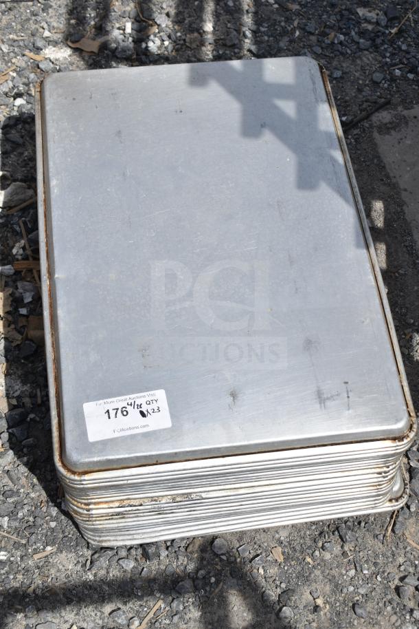 Stack of 23 full-size baking pans, showing signs of use, with a label reading "176", "Qty x23". Great for commercial use.