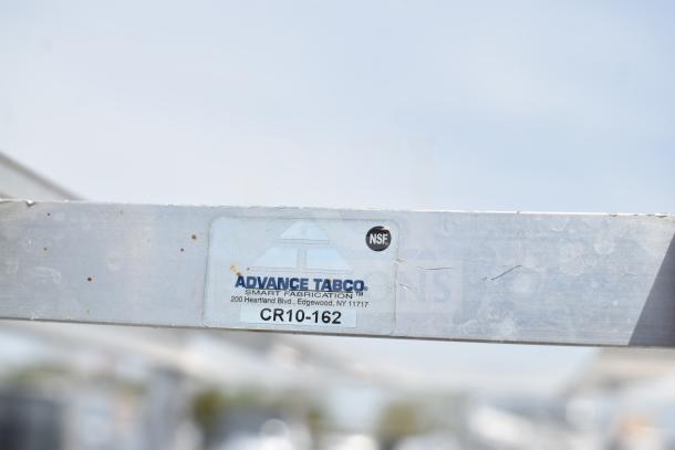 Commercial #10 can rack by Advance Tabco, model CR10-162, on commercial casters. Label shows NSF certification.