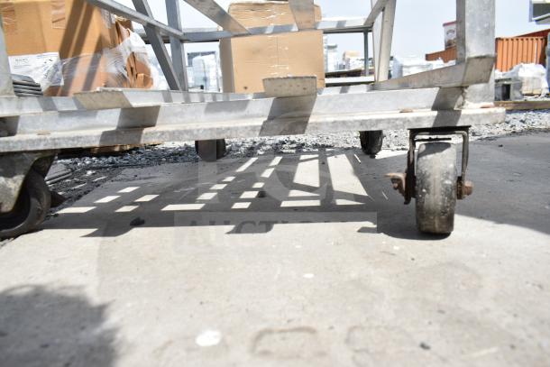 Commercial #10 Can Rack on casters, metal frame, used condition, suitable for large-scale storage and easy transport.