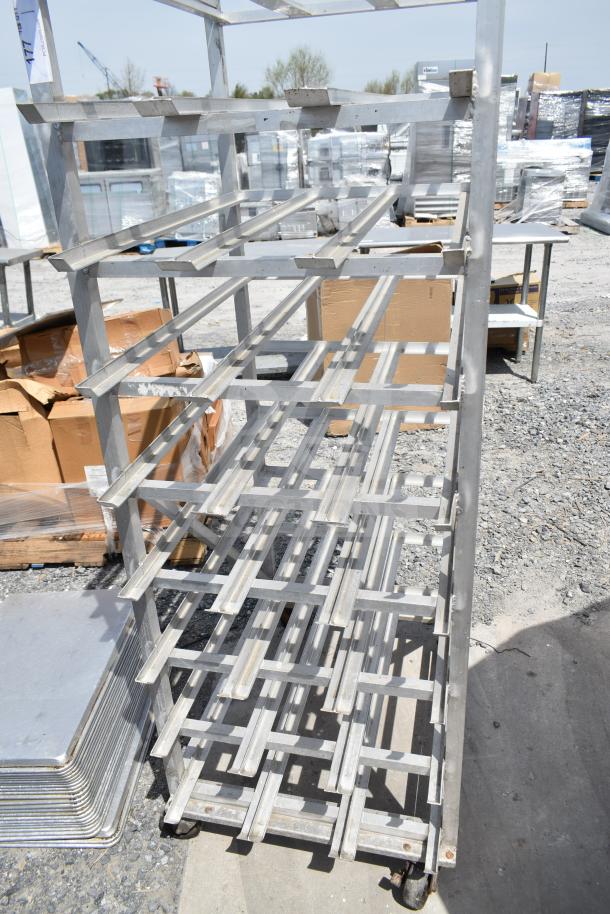Commercial #10 can rack with durable metal frame and commercial casters, ideal for storage and mobility. Slightly worn condition.