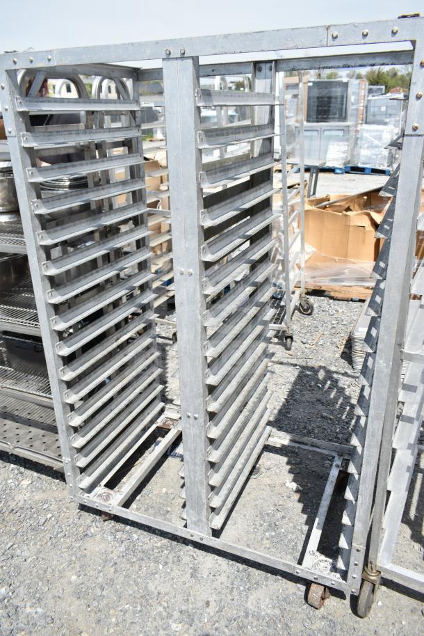 Commercial double pan transport rack with sturdy metal frame and commercial casters, suitable for industrial use.