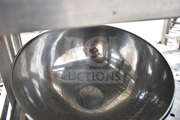 Commercial transport rack with metal bowls on commercial casters, showing durable steel construction and reflective surfaces.