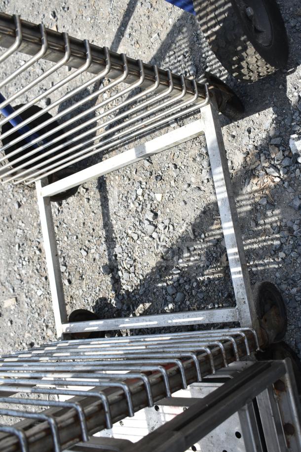 Commercial pan transport rack with sturdy metal frame and commercial casters. Used condition, ideal for kitchen use.
