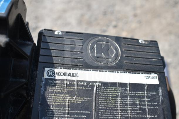 Kobalt 0241568 Concrete Mixer, black casing with logo, visible warnings, sturdy design, suitable for construction tasks.
