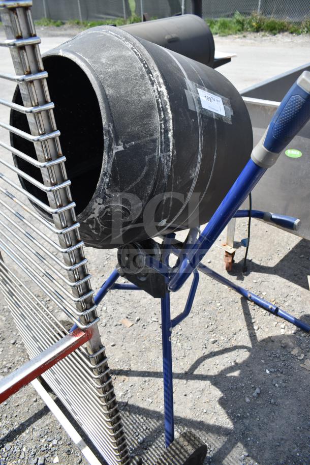 Kobalt 0241568 Concrete Mixer, weathered drum, blue frame, visible ID label, suitable for construction projects.