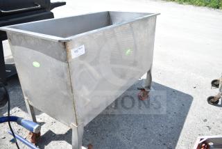 Commercial portable bin on casters, metal, with visible wear. Tag indicates item number 183, some rust on wheels.