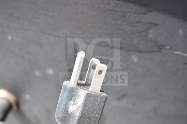 Close-up of a power plug likely used for the Pit Boss PB1500NX Savannah Pellet Grill.