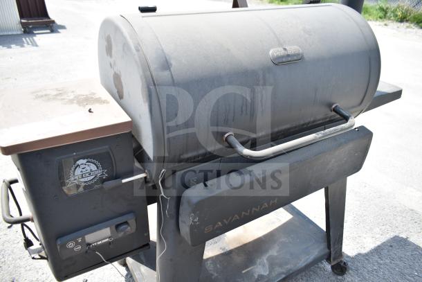 Pit Boss PB1500NX Savannah Pellet Grill with commercial casters; used condition, featuring a side control panel and visible branding.