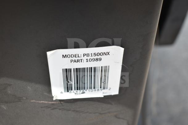 Pit Boss PB1500NX Savannah Pellet Grill with commercial casters, barcode label showing model and part number.