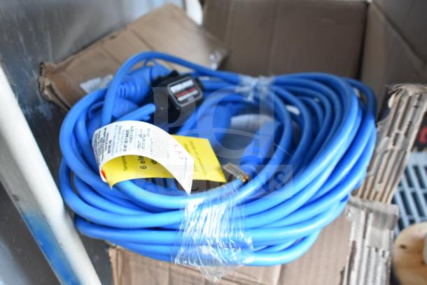 Steelman 50' blue extension cord, unused condition, with manufacturer tag attached, indicating product specifications.