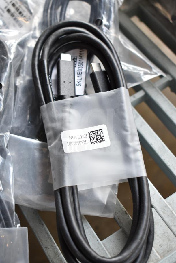 10 electronic items including AC adapter and cables in new condition, labeled with model numbers and QR codes.