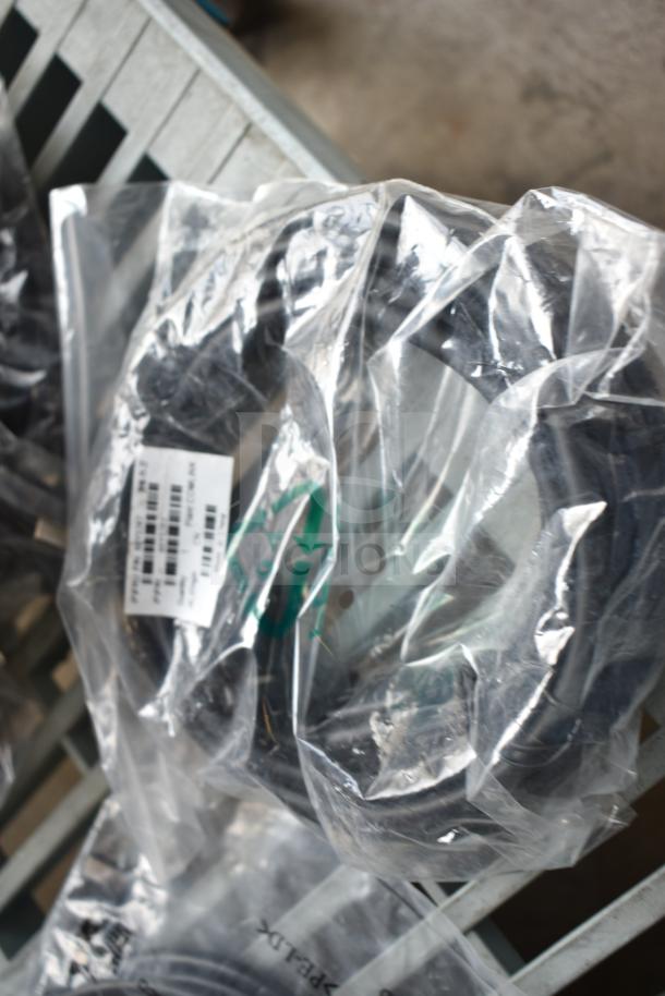 Bundle of various items including AC adapter and cables in sealed plastic bag, SKU visible. New condition.