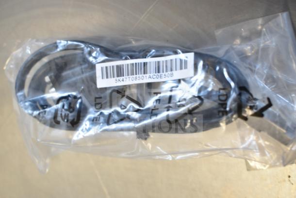 Plastic-bagged HDMI cable marked Belkin F2CD058 and AC-DC adapter. Barcode 5K47T08501AC0E50B visible.