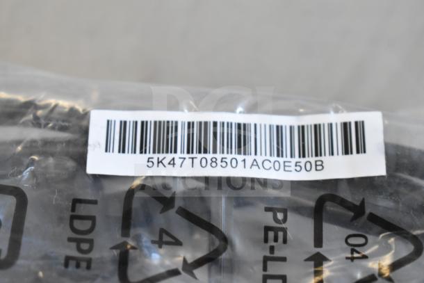 Plastic-wrapped items with barcode "5K47T08501AC0E50B," LDPE recycling label, includes Belkin HDMI cable, AC-DC adapter.