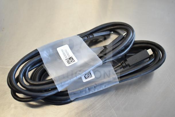 Black Belkin F2CD058 HDMI cable with white label, coiled and in new condition, included in a lot of 9 items.