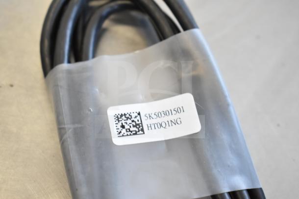 Bundle of 9 items including Belkin F2CD058 HDMI cable, AC-DC adapter. Visible label with QR code and serial number.