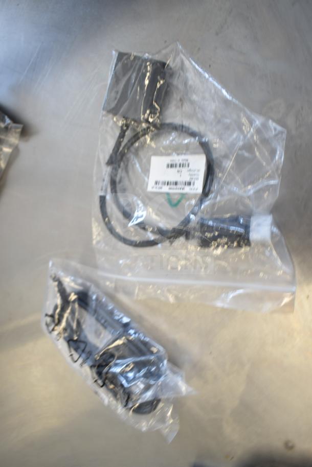 Assorted cables, including models 5KL1E03501HY1EUNE, 5K47T08501AC0EFD3, 3AA01019500, in sealed plastic bags, appear new.