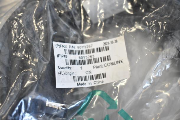 Nine assorted cables with labels indicating part numbers 80Y3267 and 80Y3263, made in China, originally from plant COMLINK.