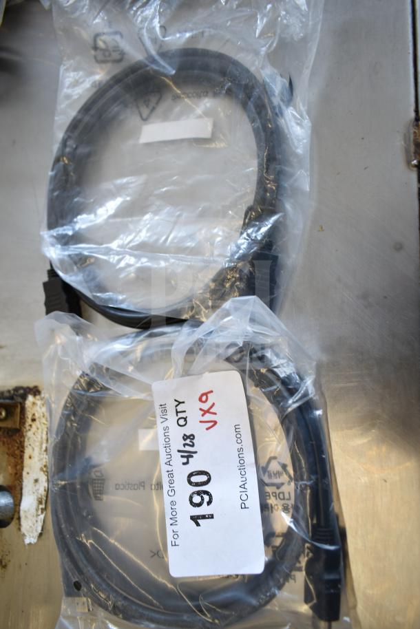 9 assorted cables, including Belkin adapter, in clear packaging. Tags show auction info and quantity, 9 times your bid.