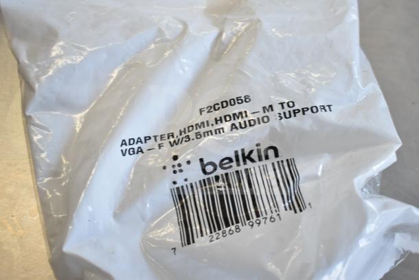 Belkin HDMI to VGA adapter in packaging, labeled F2CD058, with 3.5mm audio support and barcode visible.