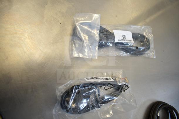 9 various cables including models 5K0EH03516JH0GLR7, Belkin adapter, 2EA247BW04DEO3L16FZ, 5KL1E03501HY1ER8H in sealed plastic bags.