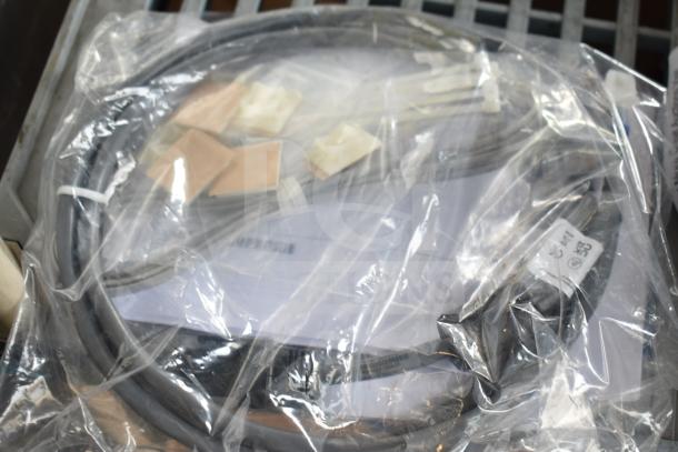 0352-0714-01 Antenna Cable in sealed plastic with tags. Appears new, suitable for specialized equipment connection.