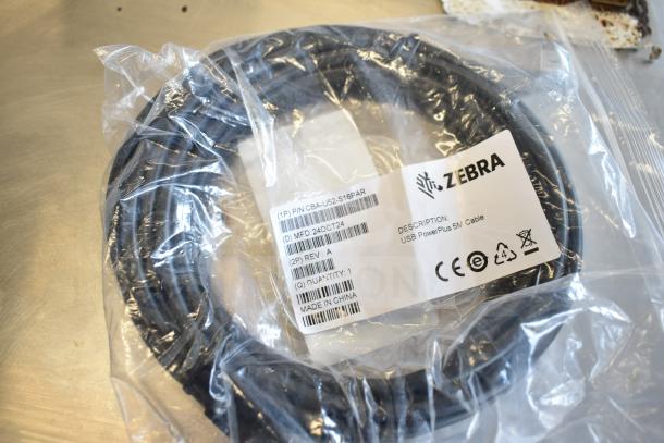 Zebra CBA-U52-S16PAR USB PowerPlus 5M cable in sealed packaging. Includes 8 additional cables. Made in China.