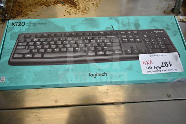Logitech K120 keyboard in original packaging, labeled as brand new scratch and dent.
