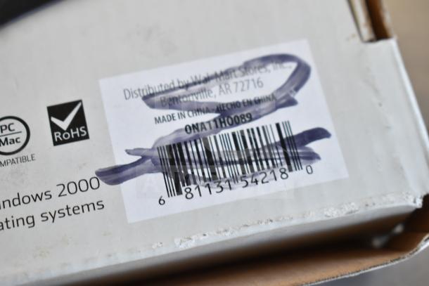 Packaging for a keyboard showing a barcode with the text "Distributed by Wal-Mart Stores, Inc." and model "ONA11HO089."