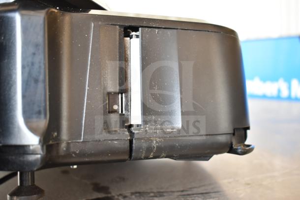 Hobart HTi-7LH4W commercial scale, black casing, tested and working condition. Visible wear marks on the side.