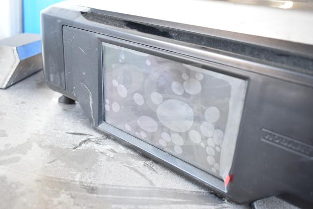 2025 Hobart HTi-7LH4W food portioning scale, tested, black exterior, touchscreen, 120/208-240V, 1 phase, working condition.