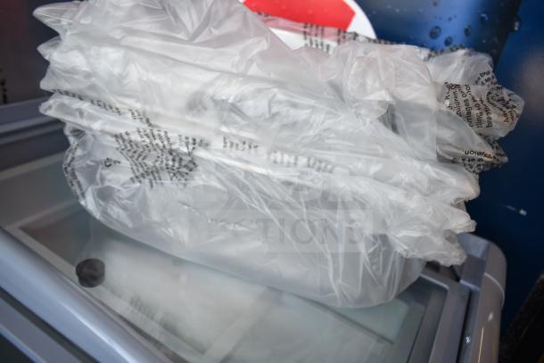 Brand new KoolMore KM-GDC-26SD 5-pan gelato dipping cabinet, 6 cu. ft., with sliding glass door and commercial casters.