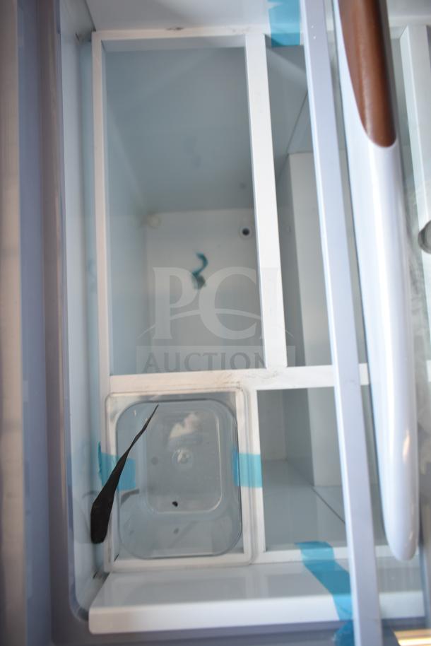 Brand new KoolMore KM-GDC-26SD 5-pan gelato cabinet, sliding glass door, scratch and dent, 6 cu. ft., on commercial casters.