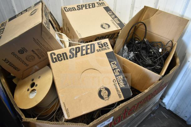 Pallet lot of GenSpeed Cat 5e Riser Cables, includes several boxes, some opened; marked "GenSPEED 5e Series."