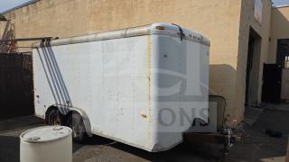 US Cargo 16' enclosed trailer, white exterior, dual axles, visible wear. Features side lighting and rear door access.