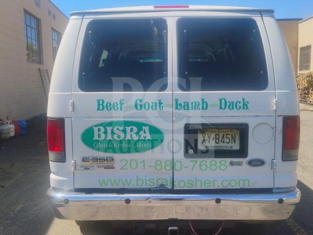2010 Ford E350 Commercial Cargo Van, white, with business decals. Rear view, clear title, odometer 162,472 miles.