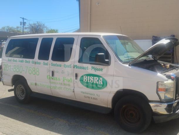 2010 Ford E350 Commercial Cargo Van, delivery type, runs and drives, clear title, odometer: 162,472, visible business branding.