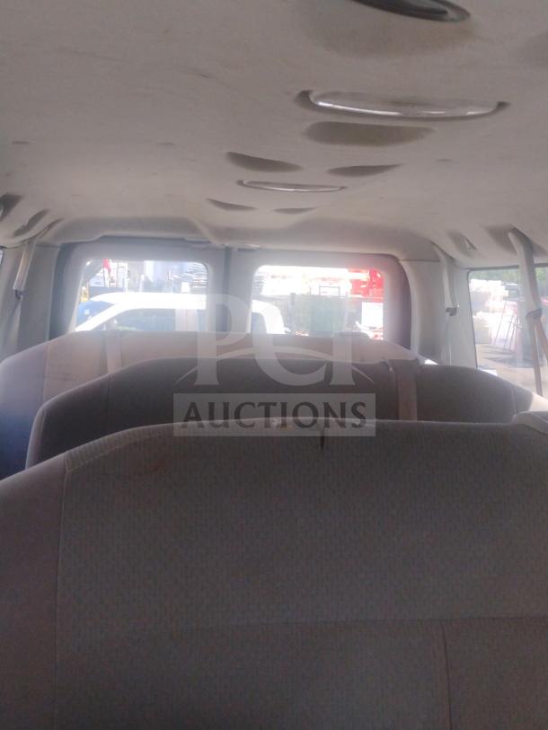 Interior of 2010 Ford E350 Commercial Cargo Van, visible seating, and ceiling. Odometer: 162,472. Clear title available.